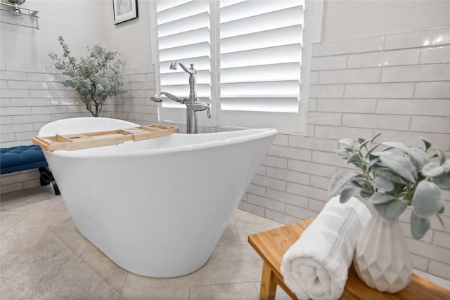 11 Bees Creek Ct, Missouri City, TX 77459 - full bathroom featuring tile walls, a freestanding bath, and wainscoting