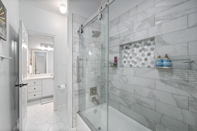 11 Bees Creek Ct, Missouri City, TX 77459 - bathroom featuring bath / shower combo with glass door, vanity, and tile patterned floors