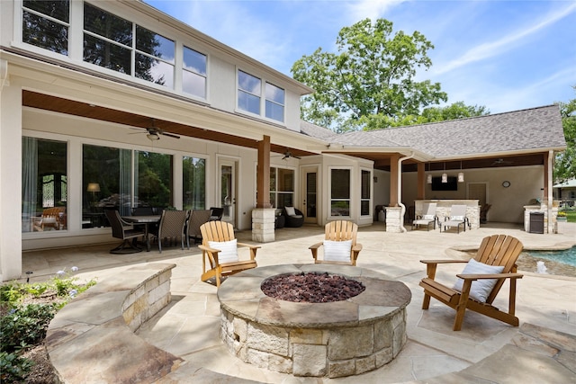 11 Bees Creek Ct, Missouri City, TX 77459 - back of property featuring ceiling fan, an outdoor fire pit, a patio, outdoor dining area, and roof with shingles
