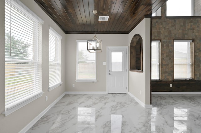 30507 Woodson Trace Dr, Spring, TX 77386 - foyer entrance featuring light marble finish flooring, a chandelier, and baseboards