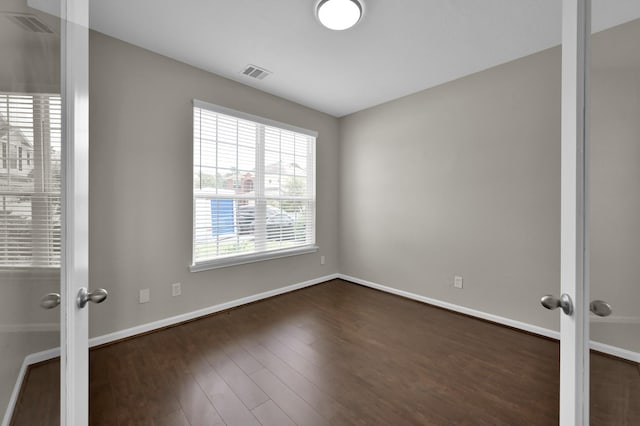 30507 Woodson Trace Dr, Spring, TX 77386 - empty room featuring dark wood-style floors, french doors, and baseboards