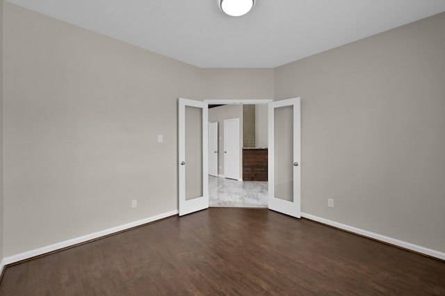 30507 Woodson Trace Dr, Spring, TX 77386 - spare room featuring french doors, dark wood-style flooring, and baseboards