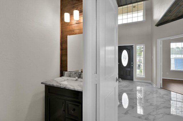 30507 Woodson Trace Dr, Spring, TX 77386 - entryway featuring marble tiled flooring, a towering ceiling, and baseboards