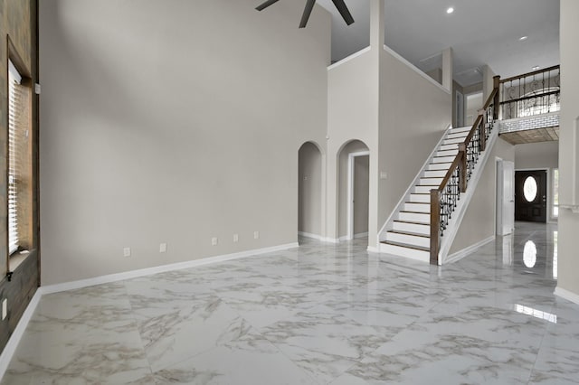 30507 Woodson Trace Dr, Spring, TX 77386 - entrance foyer featuring marble finish floors, ceiling fan, a high ceiling, baseboards, and stairway
