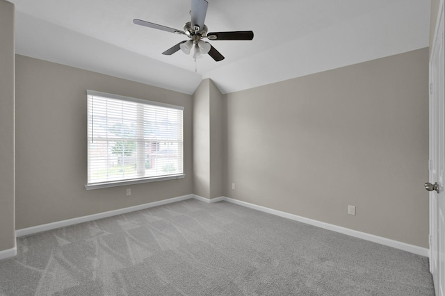 30507 Woodson Trace Dr, Spring, TX 77386 - spare room featuring light carpet, a ceiling fan, baseboards, and lofted ceiling