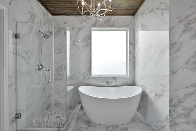 30507 Woodson Trace Dr, Spring, TX 77386 - bathroom featuring a chandelier, wooden ceiling, a freestanding bath, marble tiled flooring, and a marble finish shower