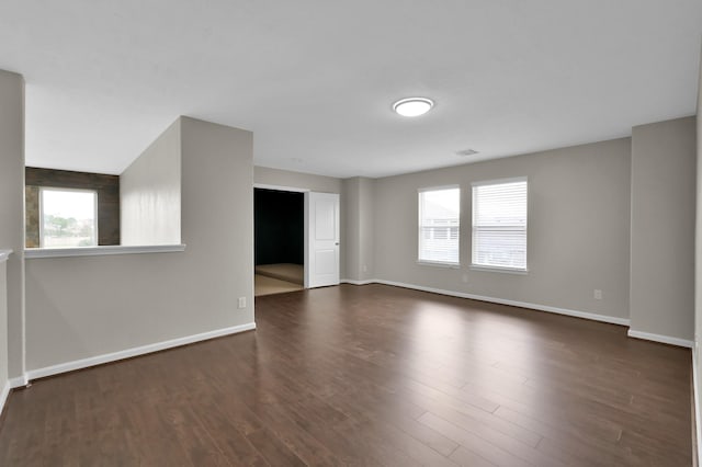 30507 Woodson Trace Dr, Spring, TX 77386 - unfurnished room featuring healthy amount of natural light, dark wood-type flooring, and baseboards