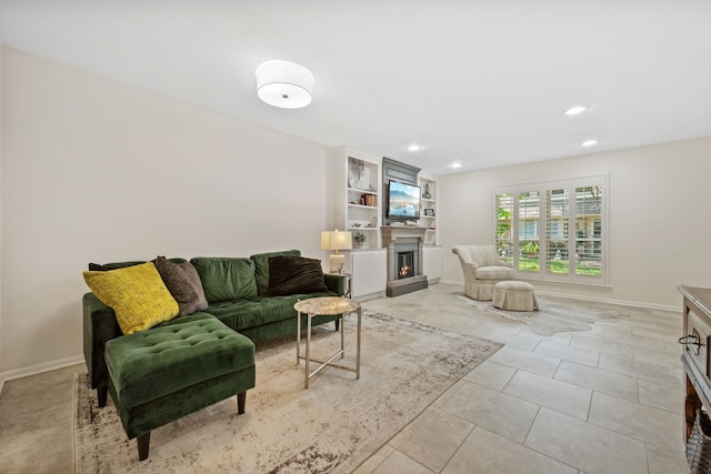 5859 Doliver Dr Unit 14, Houston, TX 77057 - living room with recessed lighting, a lit fireplace, baseboards, and light tile patterned floors