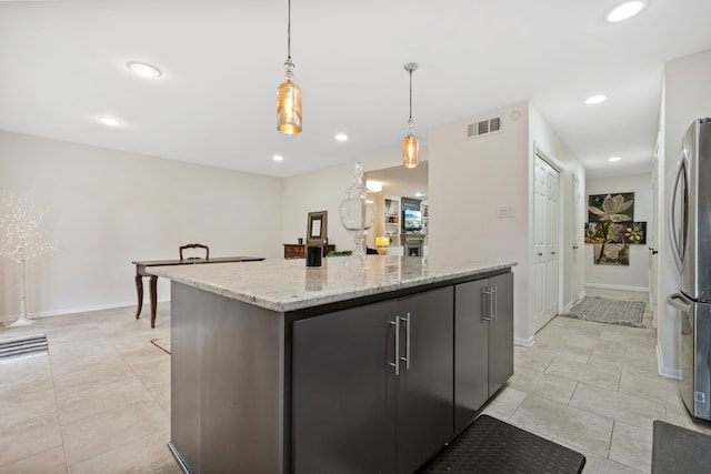 5859 Doliver Dr Unit 14, Houston, TX 77057 - kitchen with freestanding refrigerator, pendant lighting, a center island, recessed lighting, and light stone counters