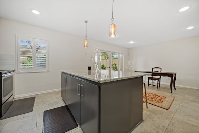 5859 Doliver Dr Unit 14, Houston, TX 77057 - kitchen featuring stainless steel electric range oven, a kitchen island, pendant lighting, light tile patterned flooring, and baseboards
