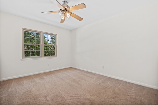 5859 Doliver Dr Unit 14, Houston, TX 77057 - spare room with light carpet, baseboards, and a ceiling fan