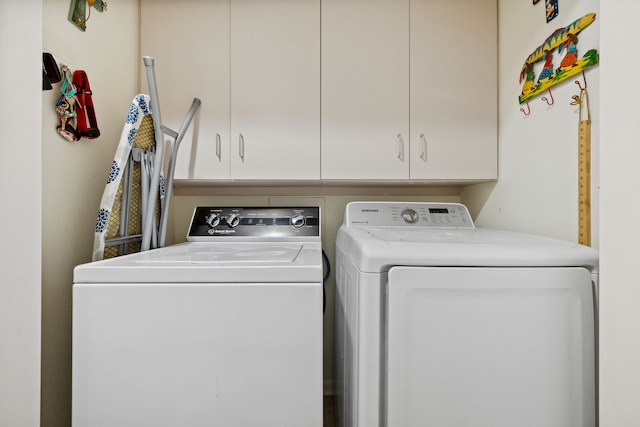 5859 Doliver Dr Unit 14, Houston, TX 77057 - laundry room featuring washing machine and clothes dryer and cabinet space