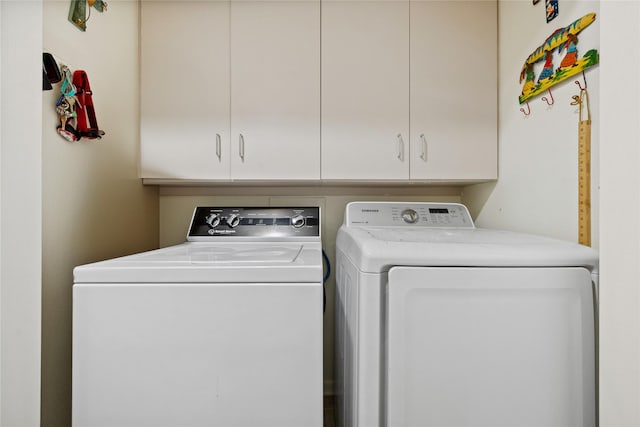 5859 Doliver Dr Unit 14, Houston, TX 77057 - laundry area featuring independent washer and dryer and cabinet space