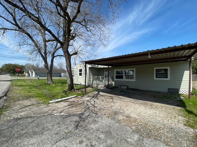 3707 Rosemont St, Houston, TX 77051 - view of side of property with a carport and driveway