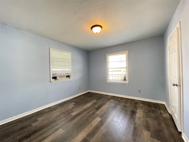 3707 Rosemont St, Houston, TX 77051 - unfurnished room with dark wood-style floors, baseboards, and a textured ceiling