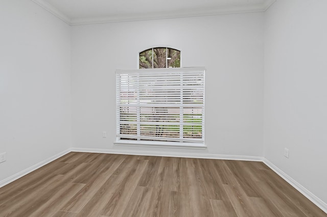 2918 Linda Dr, Pearland, TX 77584 - unfurnished room featuring wood finished floors, crown molding, and baseboards