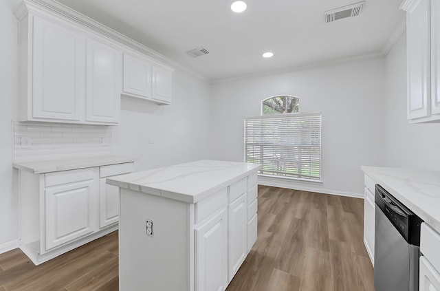 2918 Linda Dr, Pearland, TX 77584 - kitchen with stainless steel dishwasher, wood finished floors, white cabinetry, recessed lighting, and crown molding