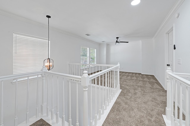 2918 Linda Dr, Pearland, TX 77584 - corridor with carpet, an upstairs landing, crown molding, and a chandelier