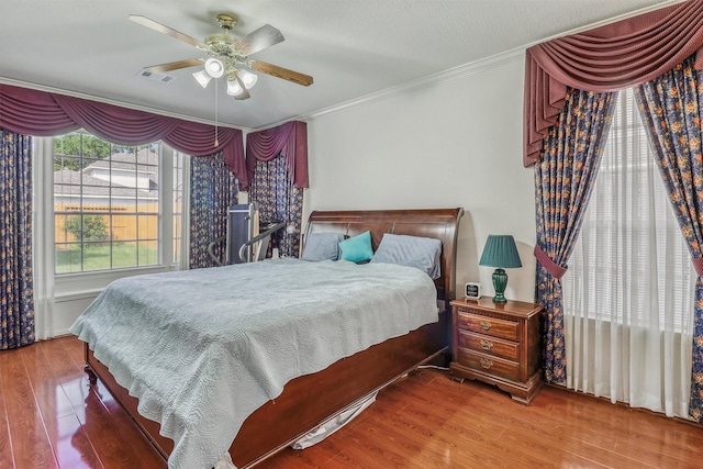 23207 Greenrush Dr, Katy, TX 77494 - bedroom featuring wood finished floors, ornamental molding, and ceiling fan