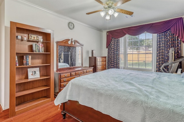 23207 Greenrush Dr, Katy, TX 77494 - bedroom with wood finished floors, crown molding, and ceiling fan