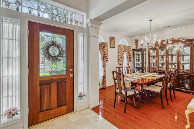 23207 Greenrush Dr, Katy, TX 77494 - foyer with a chandelier, crown molding, and light wood-type flooring