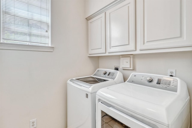 23207 Greenrush Dr, Katy, TX 77494 - laundry area featuring separate washer and dryer and cabinet space