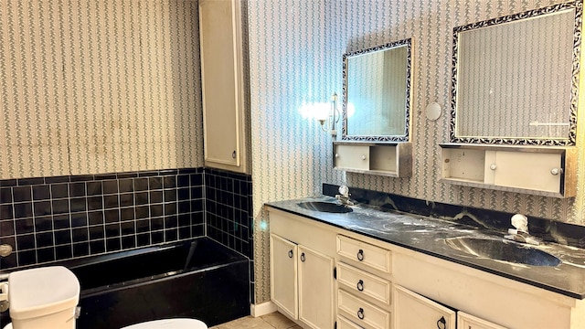 430 Hooks Rd, Livingston, TX 77351 - full bathroom featuring wallpapered walls, a bath, double vanity, and tile patterned flooring