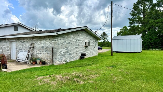 430 Hooks Rd, Livingston, TX 77351 - view of side of property featuring a lawn and an outdoor structure