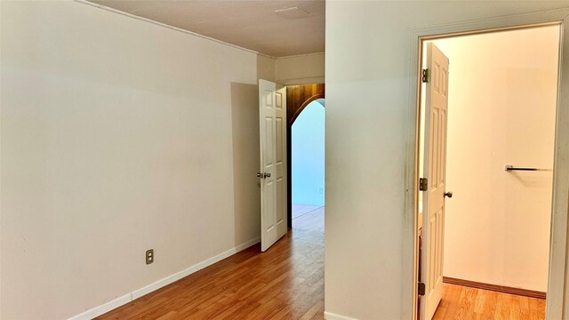 430 Hooks Rd, Livingston, TX 77351 - corridor featuring light wood-style floors and arched walkways