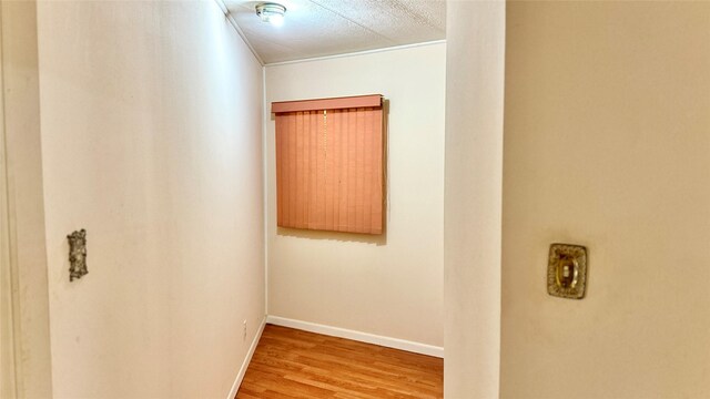 430 Hooks Rd, Livingston, TX 77351 - corridor featuring wood finished floors and baseboards