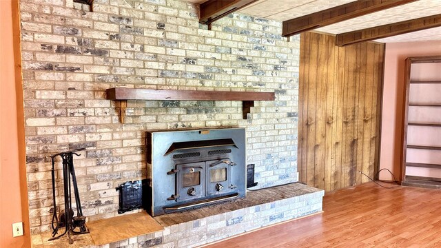 430 Hooks Rd, Livingston, TX 77351 - detailed view of a wood stove, wood finished floors, and wooden walls