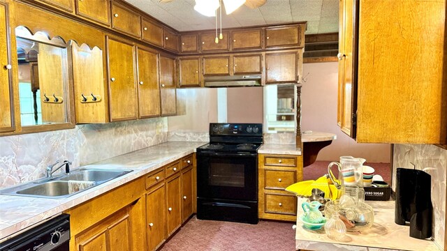 430 Hooks Rd, Livingston, TX 77351 - kitchen with black electric range, dishwashing machine, under cabinet range hood, and brown cabinets