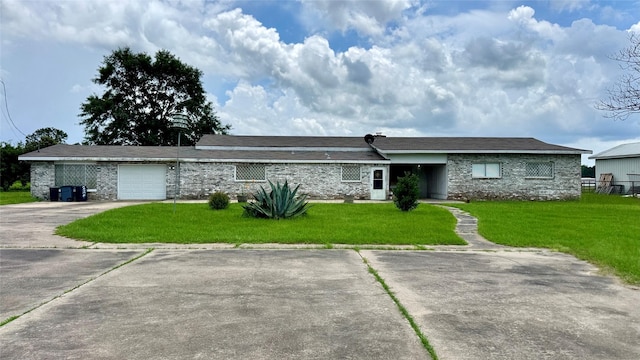 430 Hooks Rd, Livingston, TX 77351 - ranch-style home with a front lawn, concrete driveway, and a garage