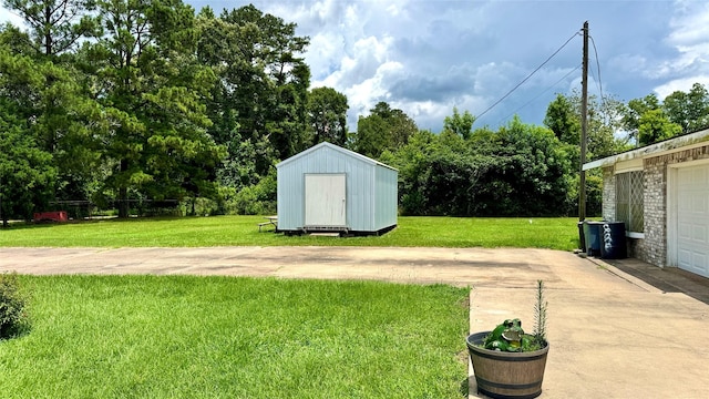 430 Hooks Rd, Livingston, TX 77351 - view of grassy yard with a storage unit and view of wooded area