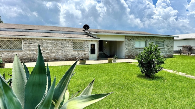 430 Hooks Rd, Livingston, TX 77351 - back of house featuring brick siding and entry steps