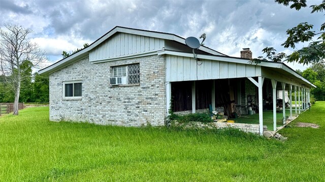 430 Hooks Rd, Livingston, TX 77351 - view of side of property featuring a chimney and a yard