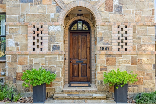 1647 Bissonnet St, Houston, TX 77005 - doorway to property featuring stone siding