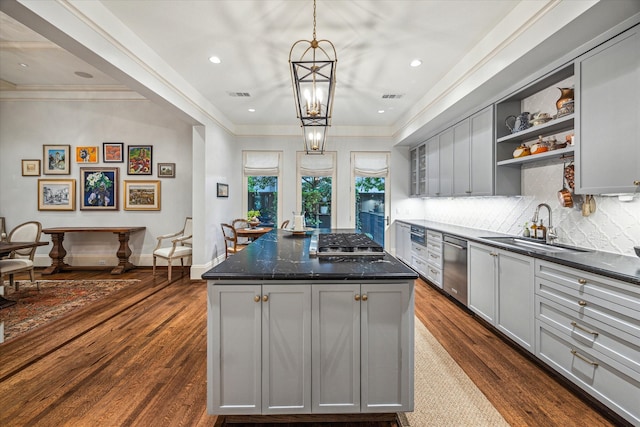 1647 Bissonnet St, Houston, TX 77005 - kitchen with gray cabinets, a sink, dark wood finished floors, crown molding, and recessed lighting