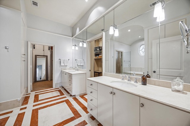 1647 Bissonnet St, Houston, TX 77005 - full bath featuring two vanities, inlaid floor details, and recessed lighting