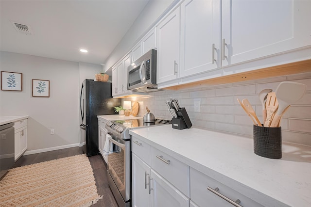 14688 Perthshire Rd Unit C, Houston, TX 77079 - kitchen with appliances with stainless steel finishes, white cabinets, light countertops, tasteful backsplash, and dark wood-style flooring