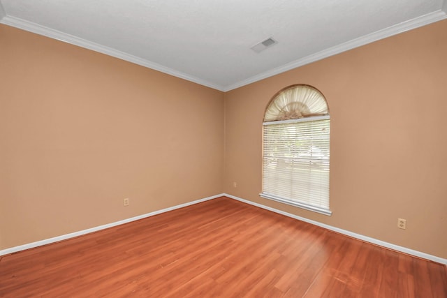 4907 Heritage Plains Dr, Friendswood, TX 77546 - spare room with light wood-style floors, baseboards, and crown molding