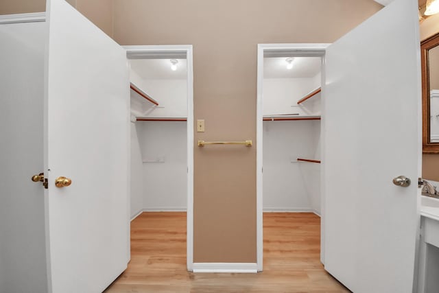 4907 Heritage Plains Dr, Friendswood, TX 77546 - spacious closet featuring light wood finished floors