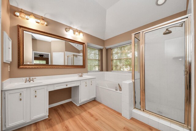 4907 Heritage Plains Dr, Friendswood, TX 77546 - full bathroom with wood finished floors, a stall shower, and a bath