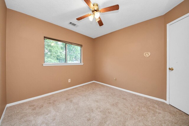 4907 Heritage Plains Dr, Friendswood, TX 77546 - empty room featuring carpet, a ceiling fan, and baseboards