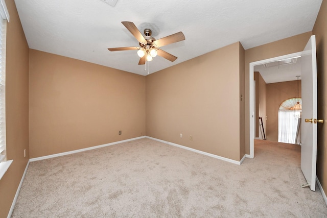4907 Heritage Plains Dr, Friendswood, TX 77546 - carpeted empty room with attic access, a ceiling fan, and baseboards