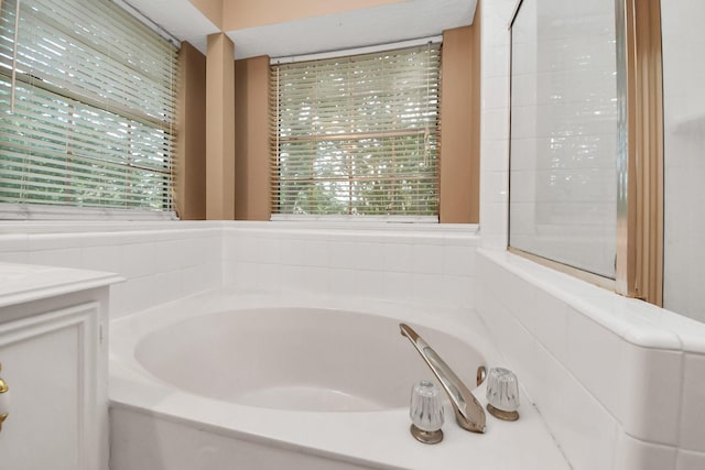 4907 Heritage Plains Dr, Friendswood, TX 77546 - full bathroom featuring a garden tub and vanity