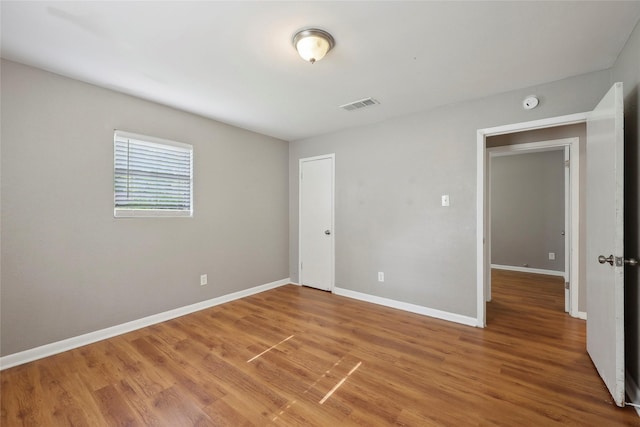 9270 Mclean St, Beaumont, TX 77707 - unfurnished bedroom with light wood-style flooring and baseboards