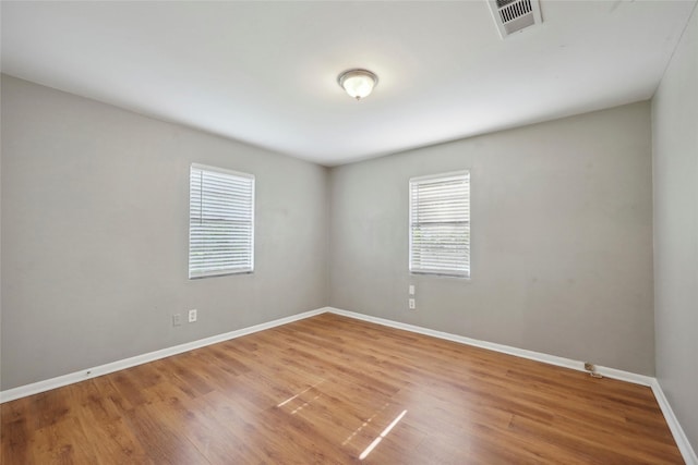 9270 Mclean St, Beaumont, TX 77707 - spare room featuring baseboards and wood finished floors