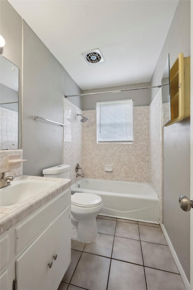9270 Mclean St, Beaumont, TX 77707 - full bath featuring tile patterned floors, vanity, bathing tub / shower combination, and toilet