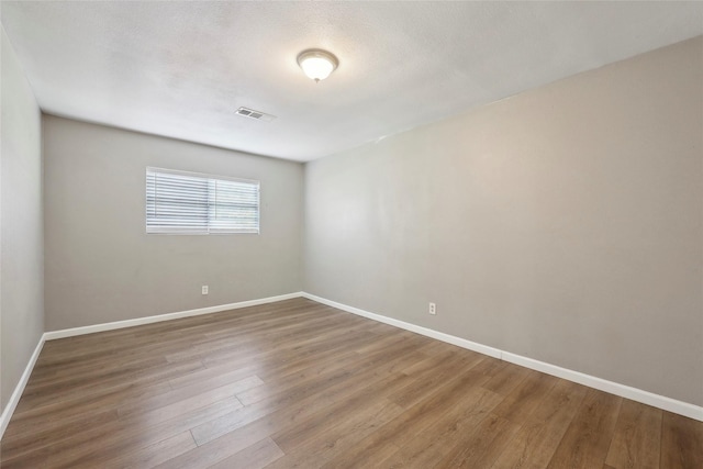 9270 Mclean St, Beaumont, TX 77707 - empty room with baseboards and wood finished floors
